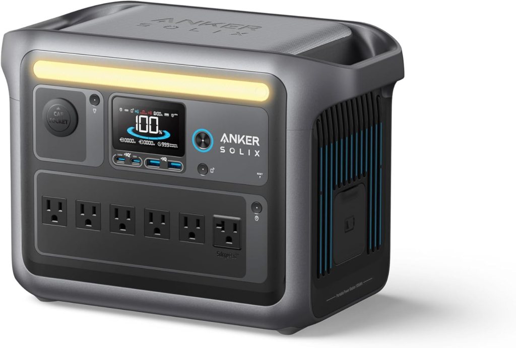 A portable Anker SOLIX power station with a display screen, multiple AC outlets, and a sturdy handle—one of the best solar gadgets for off-grid camping 2025—designed for charging devices and providing backup power wherever you go.